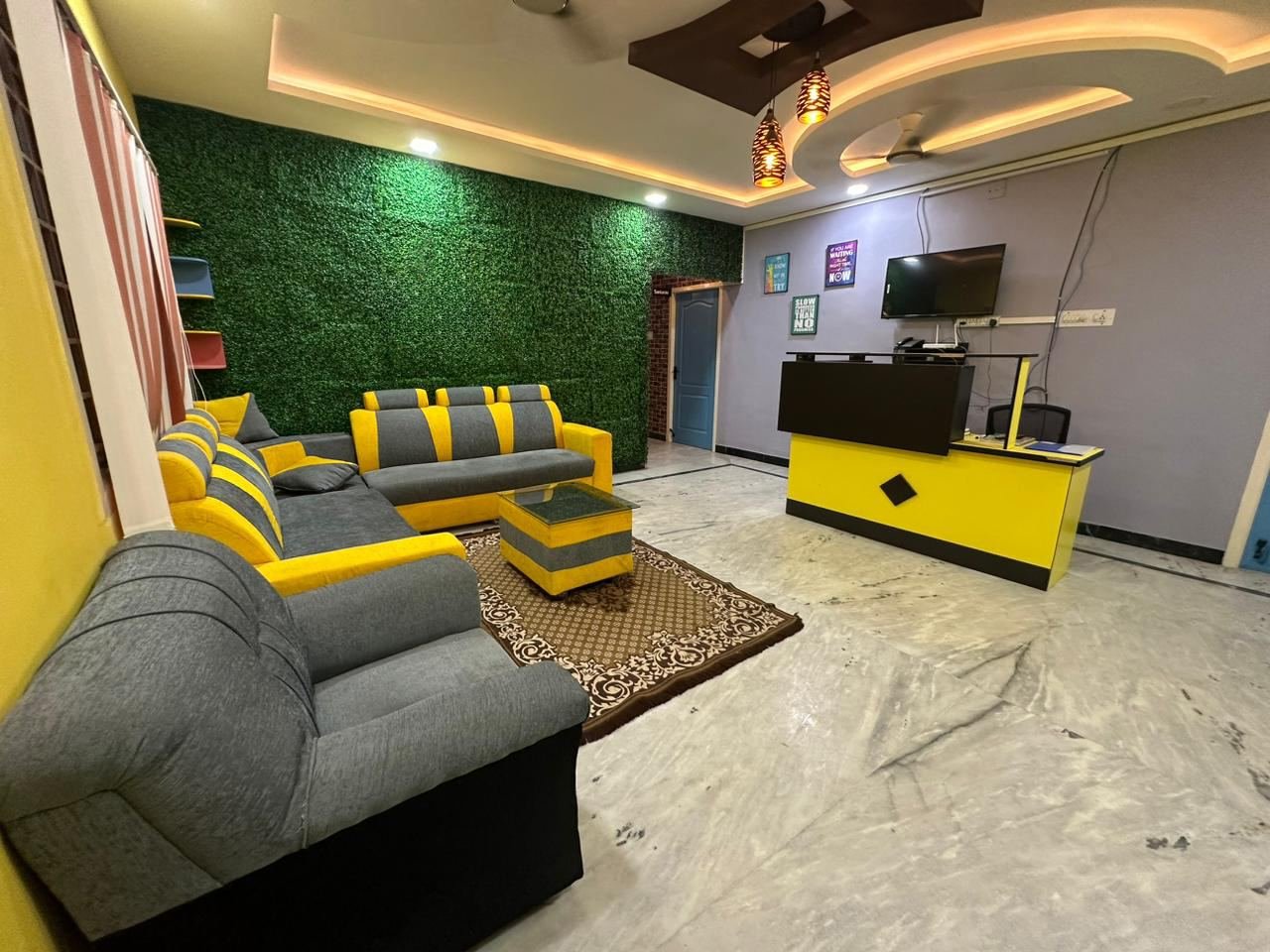 Office space with a striped feature wall and workstation